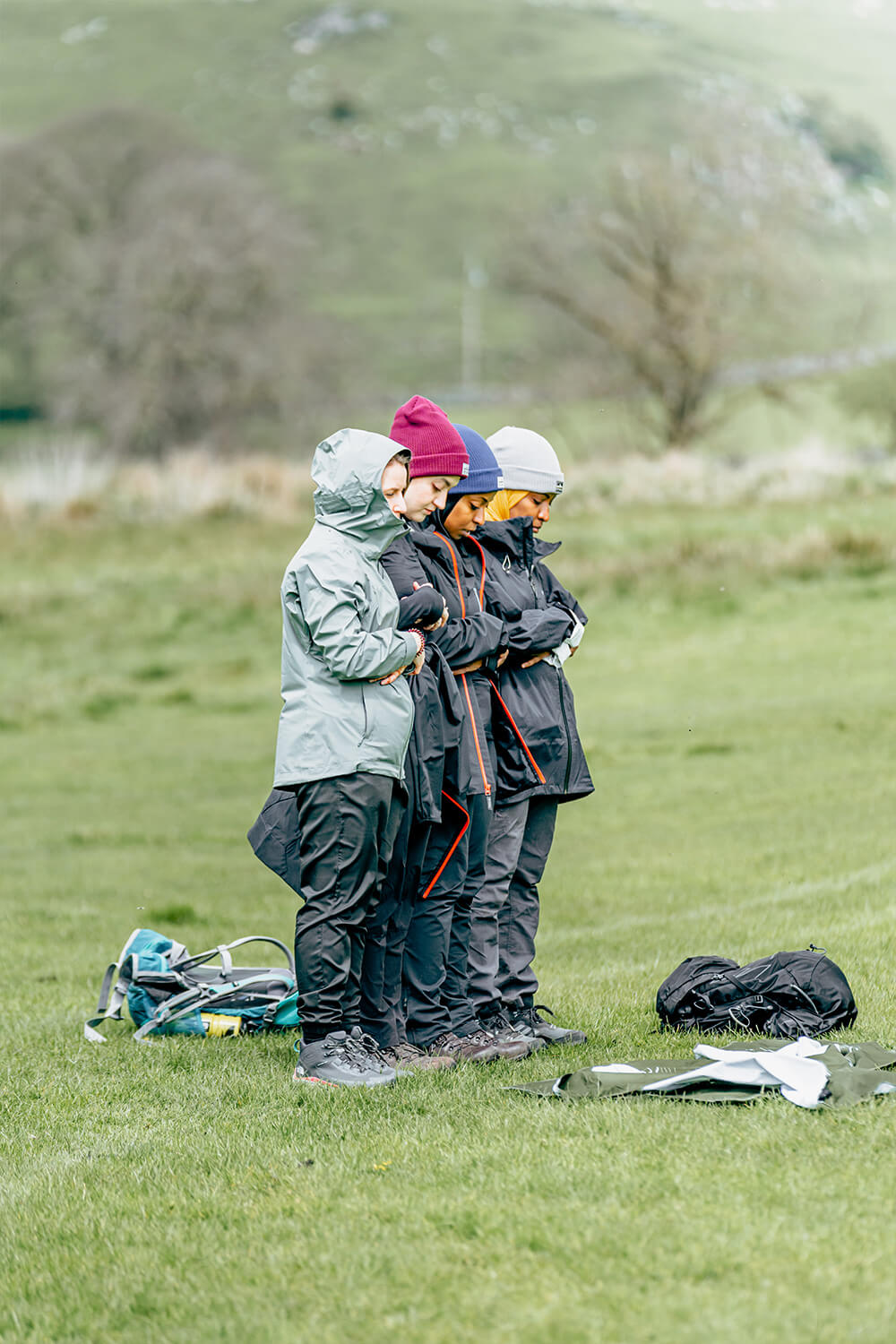 People praying together outdoors
