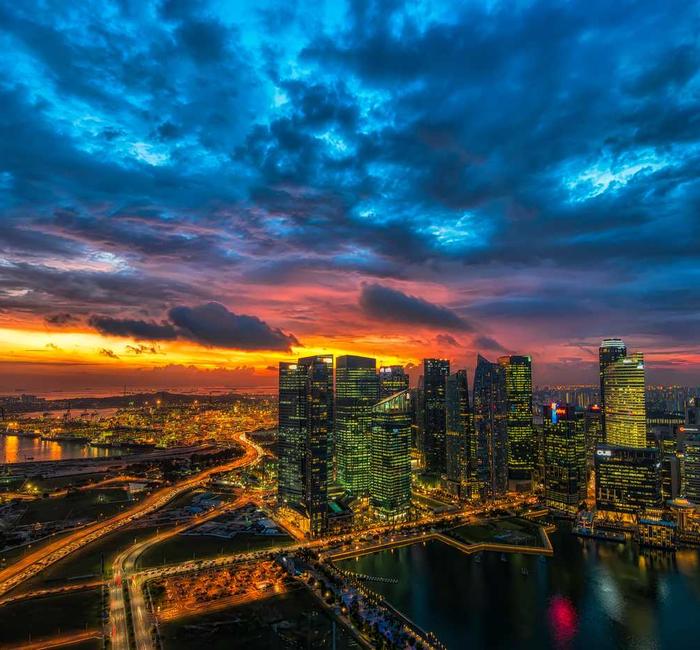 City skyline under a dramatic sunset